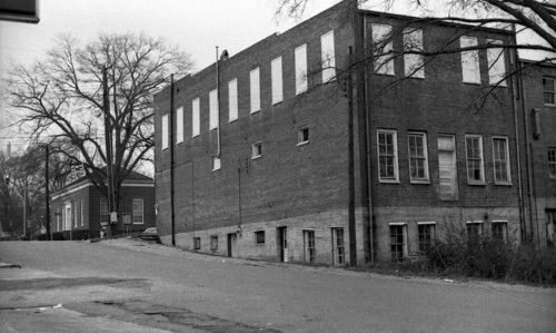 This is a view from the rear of the Masonic building in 1972.The windows on the top floor have long been blocked so that outsiders could not view the Masonic ceremonies that took place inside.